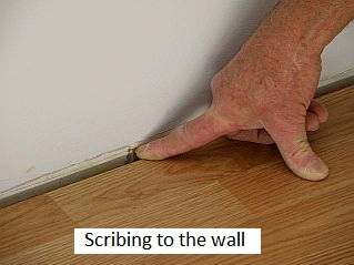 Photo of how to scribe to a wall along a laminate floor.