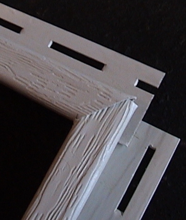 Photo of j-strip top to side fit with miter cut.