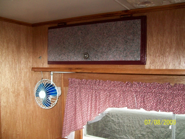 Photo of the bedroom area of the old camper after it was renovated.