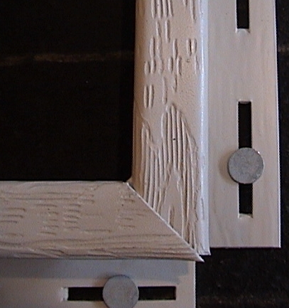 Photo of j-bottom to side fit with miter joint.